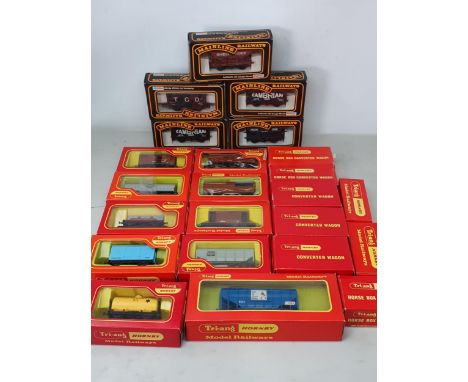 Eighteen boxed Triang Hornby Wagons including Horse Box Converter, Cattle Wagon, Fish Van, etc., and five boxed Mainline Wago