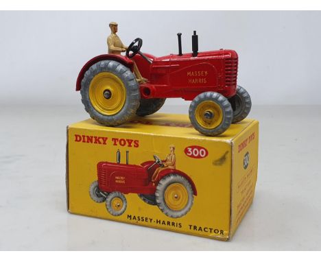 A boxed Dinky Toys No.300 Massey-Harris Tractor, M, box Ex pus with packing