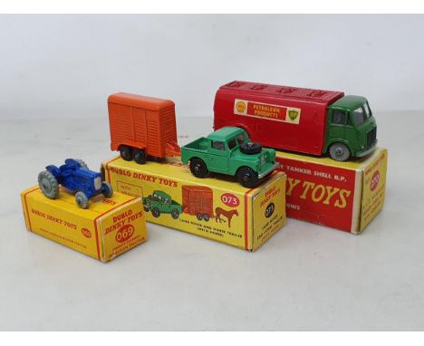 Three boxed Dublo Dinky Toys including 069 Tractor, 070 Mercury Tanker and 073 Land Rover and Trailer with black ramp, all M,
