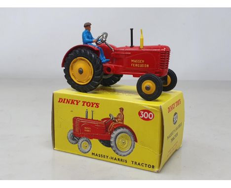 A boxed Dinky Toys No.300 Massey-Harris Tractor with plastic driver, M, box Nr perfect