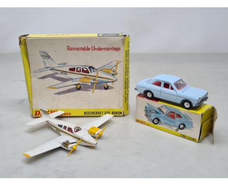 A boxed Dinky Toys No.168 pale blue Ford Escort, G, box G (one flap tongue missing), and a boxed Dinky Toys No.715 Beechcraft