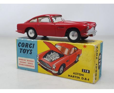 A boxed Corgi Toys No.218 red Aston Martin D.B.4, nR m-m, BOX eX
