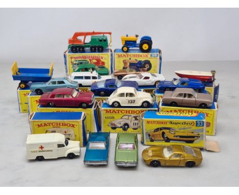 Fourteen boxed Matchbox Models including No.39 Ford Tractor, No.30 Crane, No.14 Iso Grifo, No.54 Ambulance, No.41 Ford G.T., 