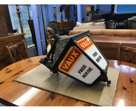 A Vaux advertising hanging electric light