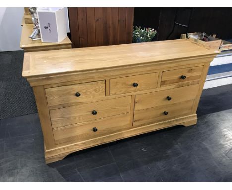A light oak chest of drawers, 151cm wide