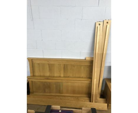 A light oak blanket box and bed frame