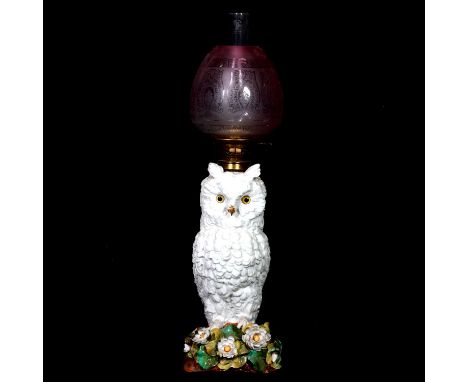 Large German porcelain novelty oil lamp, designed as a long-eared owl, 51cm, complete with chimney and shade, 76cm overall.Qt