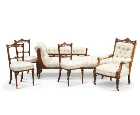 A VICTORIAN WALNUT SIX-PIECE PARLOUR SUITE, comprising chaise longue, open armchair and four side chairs, each with carved fr