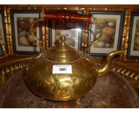 An Old Brass Toddy Kettle with Amber Handle.