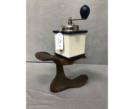 IRON SHOE LASTalong with a coffee grinder, and a hand-turn kitchen saw