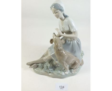 A Nao figure of a girl with dog - 23cm tall