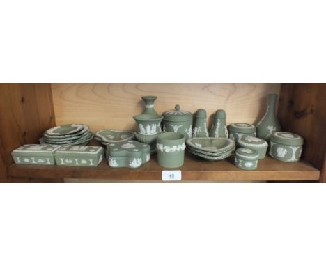 A collection of twenty Wedgwood green Jasperware trinket items 