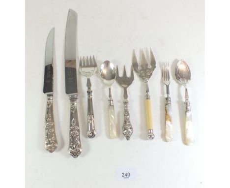 A selection of silver and silver handled serving cutlery including a Walker and Hall cake fork