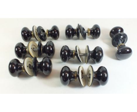 Seven sets of black ceramic door handles