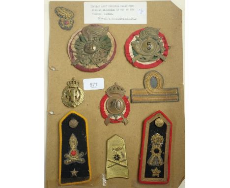 Nine items of Italian WWII military army insignia taken from Italian POWs in the western desert