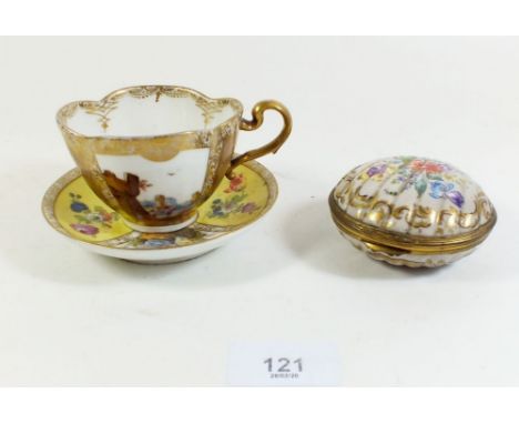 A Dresden cabinet cup painted landscapes, a later matched saucer, and a Dresden shell form trinket pot