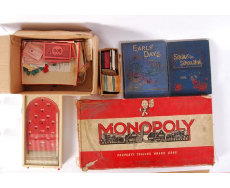 A collection of assorted vintage toys to include; an original Monopoly set with a box or spare bits, vintage books titled 'Ea