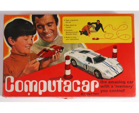 An original retro 1970's/1980's Mettoy Computacar. Within original box complete with bollards, car, instruction manual &amp; 