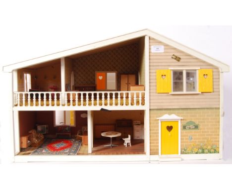 An original retro 1970's Barton 'Caroline's Home' dolls house complete with a large quantity of original furniture and carpet
