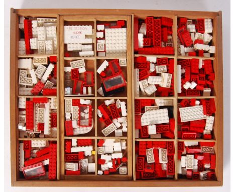 An original wooden box of vintage 1950's/1960's Lego comprising of; bricks, windows, petrol pumps etc. Within its original wo