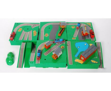 An original Ertl miniature Thomas The Tank engine village with buildings and diecast model trains to include; Thomas &amp; fr