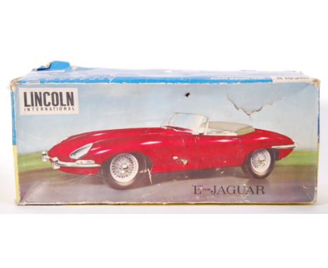 An original vintage Lincoln International remote control 'E' type Jaguar 71 02. Appears complete &amp; within original box.&n