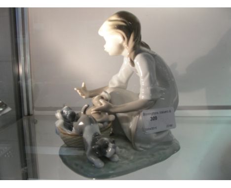 A Lladro figure of a girl with puppy, 5595