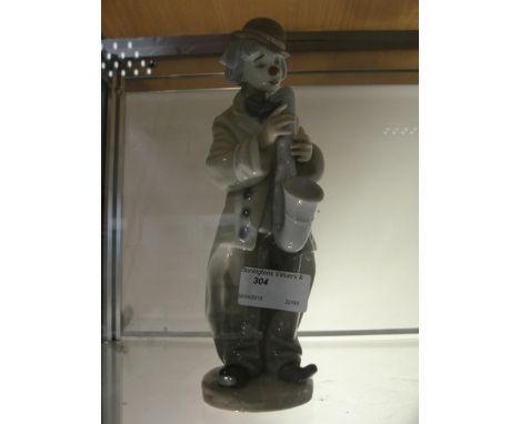A Lladro figure of a clown playing the saxophone, 5471