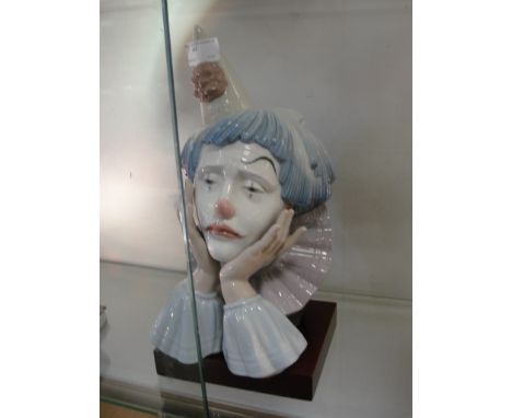 A Lladro figure of a clown and stand, 5129