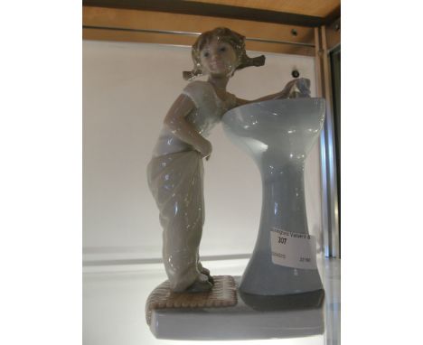 A Lladro figure of a girl at basin, 4838
