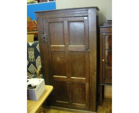 A panelled oak wardrobe