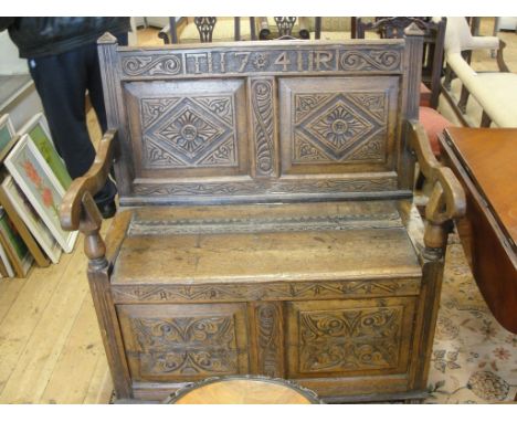 An oak monk's bench dated 1741