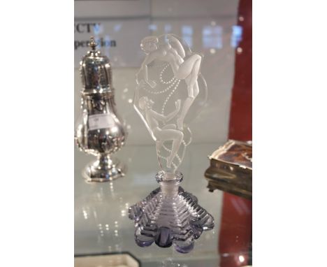 An Art Deco glass perfume bottle "Flacon Eroticon" by Ingrid Czechoslovakia on step cut amethyst glass base, signed to base "