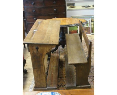 A 1920s Belgian oak school desk and bench