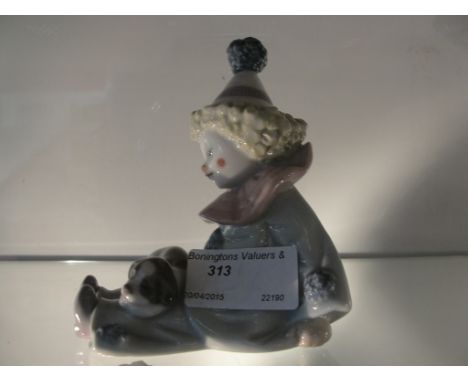 A Lladro figure of a clown with dog
