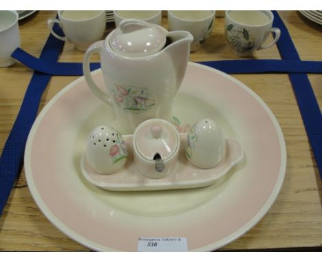 A Susie Cooper 'Dresden' pattern pink cruet set, gravy jug and plate