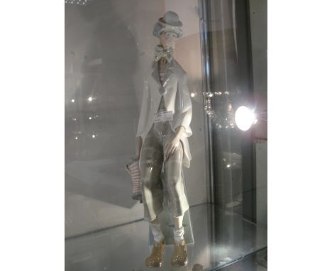 A Lladro figure of a clown with concertina, 1027