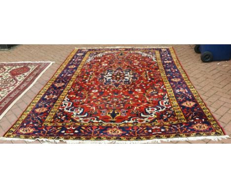 A Persian Bakhtiari carpet, 313 x 216 cm