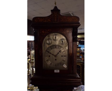 A longcase style clock, the 19 cm arched silvered dial with Roman numerals, and subsidiary Chime/Silent, Slow/Fast and Chime 