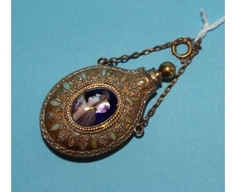 A filigree and enamel scent bottle and stopper, applied an oval enamel portrait, 5 cm high  