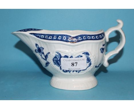 A Worcester porcelain sauce boat, decorated flowers and foliage, with blue crescent mark to base, 10.5 cm high