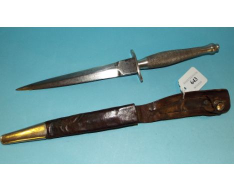 A Fairbairn & Sykes fighting knife, with a leather scabbard Condition report Report by RB

The blade has been heavily cleaned