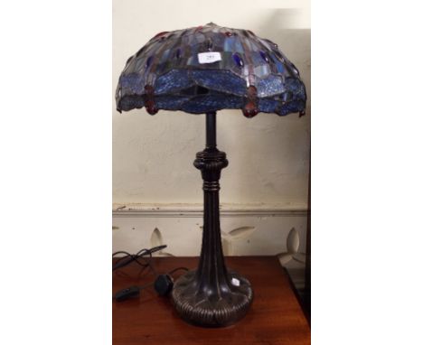 A Tiffany style table lamp, with a coloured glass shade decorated dragonflies, 70 cm high