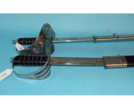 An Elizabeth II officer's sword, and scabbard, and another sword and scabbard (2)