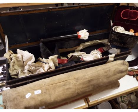 The uniform, belonging to Lt Col W B Du Pre, including his boots, in his named tin trunk, his epaulettes, and two camp type b