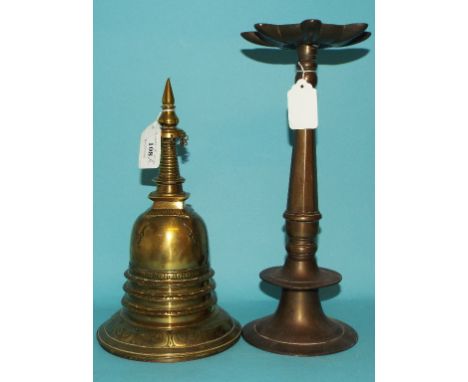 An Eastern brass stupa, 25.5 cm high, and an Islamic lamp, signed, 31 cm high (2)