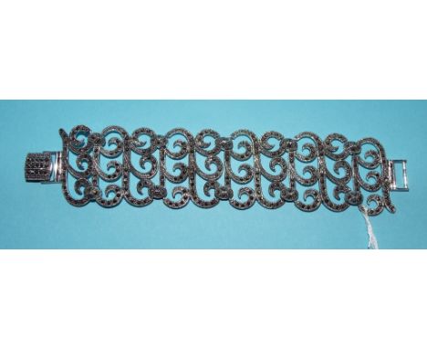 A silver and marcasite wide bracelet Condition report Report by NG

Clasp stamped 925.  Modern item.  No marcasites missing o