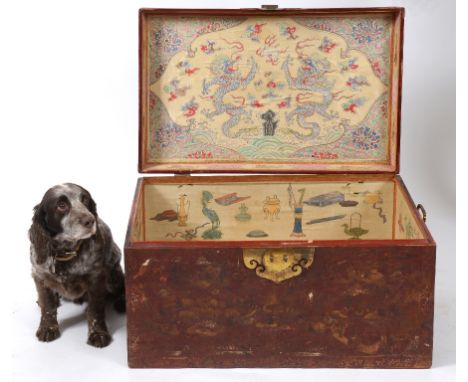 A late 19th century Chinese red leather trunk, with a drawer to each side, decorated figures, the interior decorated birds, d