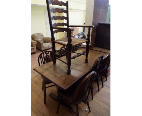 An oak refectory style table, 161 cm wide, a set of six kitchen wheel back chairs, and a ladder back armchair (8)