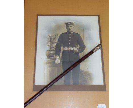 A Royal Marines Regimental Gibraltar silver coloured metal mounted swagger stick, crested, 68 cm long, and associated photogr